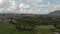 Awesome aerial view of countryside with village amidst meadows and forests