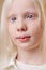 Awesome albino kid with blonde hair, isolated