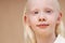 Awesome albino kid with blonde hair, isolated