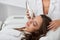 Awesome attractive woman lying with closed eyes and taking beauty procedure