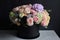 awesome bouquet of pastel flowers in sleek black vase