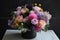 awesome bouquet of pastel flowers in sleek black vase