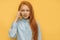 Awesome caucasian red haired girl talking on phone