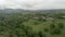 Awesome countryside aerial view with green valley and trees, hills and meadows