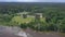 Awesome drone point of view of a trailer park next to a lake.