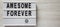 `Awesome forever` words on a lightbox on a white wooden background, top view. From above, flat lay, overhead. Copy space