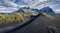 Awesome midnight sun view of Stokksnes cape with Vestrahorn Batman Mountain on background. Summer Icelandic landscape with black