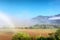 Awesome misty farm field against mountains