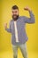 Awesome news. Beard fashion and barber concept. Man bearded hipster stylish beard yellow background. Beard and mustache