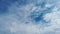 Awesome time lapse of white cirrocumulus clouds in a beautiful blue sky