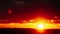 Awesome Timelapse of Sunset in the Orange Sky Behind the Layered Clouds Over the Horizon