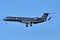 Awesome unmarked dark grey business jet in blue sky background