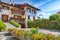 Awesome View of Traditional alpine houses with flowers on balcony the Cles city