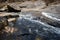 Awesome view of waterfall passing through a mountain big rock near by water reservoir.