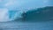 Awesome young surfer rides a beautiful emerald barrel wave in sunny Tahiti.