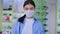 Awesome young woman asian wearing her protective mask in quarantine while she are in the shop concept of Coronavirus