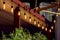 Awning in backyard gazebo with a light bulbs garland of strings.