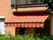 Awning sunshade in yellow and orange color canvas fabric material