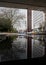 The Axis Building Birmingham Reflected in water gathered below the A38 overpass, mirror image with lots of windows from office