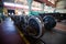 Axles with wheels of railway cars lie in a row at a repair plant