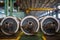 Axles with wheels of railway cars lie in a row at a repair plant