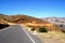 ayacucho peru mountain with curve on the road with asphalt in blue sky