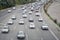 Ayalon Highway traffic with cars. Heavy traffic moves with speed along the highway