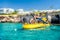 AYIA NAPA, CYPRUS - August 10, 2019: Recreational boat with tourists near the rocky cliffs near Ayia Napa. Famagusta District,