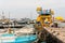 Ayia Napa, Cyprus - June 2, 2018: Port of Ayia Napa. Tourists in front of a diving boat. On the pier are different boats and