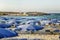 Ayia Napa, Cyprus, September 6, 2018: A beach with blue parasols in the resort town
