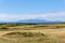 Ayrshire Golf Course to Arran hills in the hazey distance.