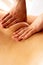 Ayurveda beck and shoulder blade massage with ayurvedic oil, girl massaging a girl, Concept of relaxation and body care. Close up