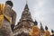 Ayutthaya temple complex in Thailand with sitting Buddha statues