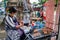 Ayutthaya, Thailand - October, 21, 2016 : Unidentified Thai woman is selling Isaan sausage, roasted pork and eggs grill at Wat Ma