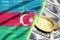 Azerbaijan flag and cryptocurrency growing trend with two bitcoins on dollar bills