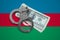 Azerbaijan flag with handcuffs and a bundle of dollars. Currency corruption in the country. Financial crimes