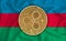 Azerbaijan flag, ripple gold coin on flag background. The concept of blockchain, bitcoin, currency decentralization in the country