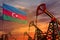 Azerbaijan oil industry concept. Industrial illustration - Azerbaijan flag and oil wells with the red and blue sunset or sunrise