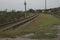 Azerbaijan railroad in with sky on green background .A railway turns upright through the spring green field. In the distance there