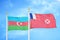 Azerbaijan and Wallis and Futuna two flags on flagpoles and blue sky