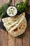 Azerbaijani food: flatbread qutab with greens and yogurt close-u