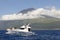 Azores coastline landscape in Pico island with whale watching bo