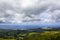 Azores Landscape with Farm Fields, city and ocean on the background on a cloudy day