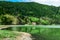 Azores, Portugal. Beautiful lake lagoa do Furnas with old church among the mountains on San Miguel Island