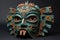 Aztec traditional, ceremonial mask on dark background. Warrior mask. Tribal totem. Aztec-inspired mask showcasing