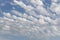 Azure blue sky with white cirrocumulus and alto cumulus	woolpacks or heap clouds