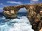 Azure window in the form of a natural arch of limestone rock in the Mediterranean Sea