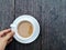 aâ€‹ cupâ€‹ ofâ€‹ Coffee, whiteâ€‹ cupâ€‹ onâ€‹ woodenâ€‹ table.