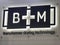 B+M company sign