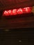 B neon meat sign in a hamburger restaurant